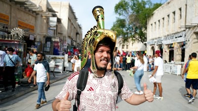 A Mexico fan in the souq area of Doha. PA