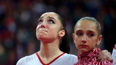 Russia's Victoria Komova (r) and team mate Aliya Mustafina react during the women's gymnastics team final. Brian Snyder/Reuters