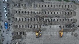 Graves are prepared for the victims of an air strike on a girls' school in Minab, southern Iran. EPA