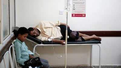 A man is treated for a suspected cholera infection at a hospital in Sanaa on July 1, 2017. Hani Mohammed / AP Photo