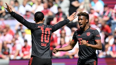 Bayern Munich forward Kingsley Coman celebrates scoring the opening goal with midfielder Leroy Sane during the match against Cologne on Saturday, May 27, 2023. AFP