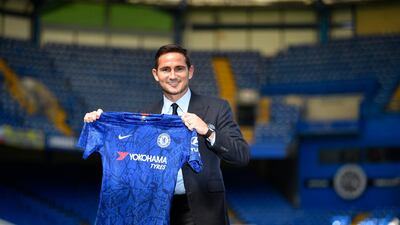 Frank Lampard poses with a Chelsea shirt at Stamford Bridge after confirming his arrival as manager on a three-year deal. EPA