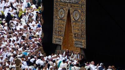 Pilgrims pray near the Kaaba as worshippers circumambulate around during Umrah in Mecca on Monday. AP Photo