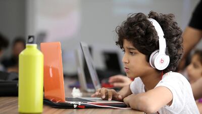 Eissa Al Mulla, 9, creates a ninja profile pageon the web development course. Pawan Singh / The National