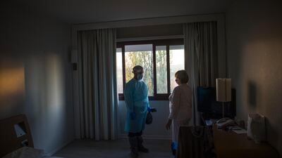 A doctor visits a Covid-19 patient to check their state of health and evaluate their release from the hotel at the Living Place Hotel. Getty Images