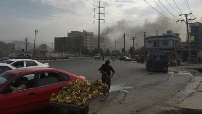 Smoke rises from the site of an attack targeting the Kabul office of the running mate of Afghan President Ashraf Ghani in Kabul. At least one person was killed and 13 others wounded in an attack targeting the Kabul office of the running mate of Afghan President Ashraf Ghani, officials said. AFP