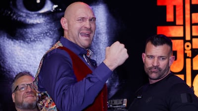 Tyson Fury poses on the stage. Reuters