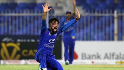 Afghanistan's Rashid Khan, pictured here in action on Monday against the UAE, has put out an appeal to help raise money for survivors of an earthquake that has gutted Afghanistan. Chris Whiteoak / The National