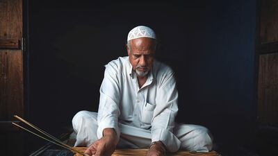 Mujtaba Al Awami, Saudi Arabia: Mujtaba captures an old man fashioning traditional household items, including baskets, chairs, and small tables, using threads of palm trees in the Ahsa’ province in eastern Saudi Arabia.