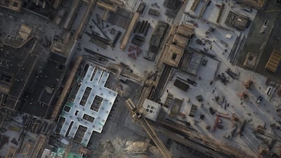 One of the tower cranes that move construction materials around the site. Silvia Razgova / The National