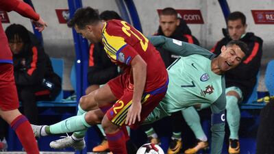 Cristiano Ronaldo is fouled by Andorra'midfielder Victor Rodriguez Pascal Pavani / AFP