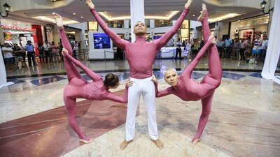 The acrobats Tatiana Ruzova, Mario Mira and Valeria Baigacheva at Mall of the Emirates. Sarah Dea / The National