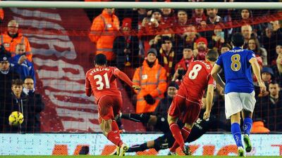 Liverpool's Steven Gerrard, second right, converts a penalty to make it 2-0 before the hosts surrendered the lead for a 2-2 draw on Thursday at Anfield against Leicester City. Peter Powell / EPA