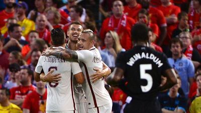 Edin Dzeko of AS Roma celebrates with teammates after scoring a goal against Liverpool during a friendly match on August 1, 2016 in St Louis, Missouri. Jeff Curry / Getty Images / AFP