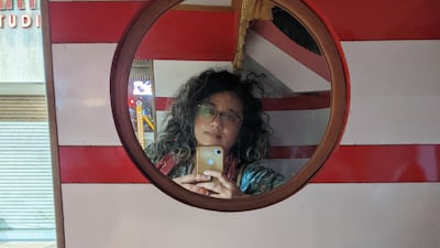 Shefali Pandey in the mirror on an auto rickshaw in Ahmedabad.