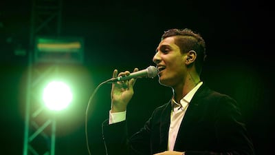 epa03889272 Palestinian singer Mohammed Assaf, winner of Arab Idol, performs during his concert, his first outside the Middle East and North Africa, in The Hague, The Netherlands, 29 September 2013. EPA/PAUL BERGEN