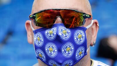 A Leicester City fan wears a face mask before the Premier League away match against Brighton and Hove Albion on September 19. Getty