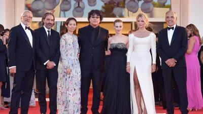 From left, Roberto Cicutto, president of the Venice Biennale, director Saverio Costanzo, director Chloe Zhao, director Bong Joon-ho, actress Sarah Gadon, actress Virginie Efira and festival director Alberto Barbera attend the red carpet for 'Madres Paralelas' during the 78th Venice International Film Festival on September 1, 2021. EPA