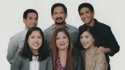 Lorna Lim Varona and her family. Mrs Varona's body was found on Friday stuffed in a bag in her car.