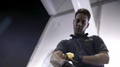 A professional ferrier, David Gingras, 34, from Quebec, Canada, demonstrates care of a stallion's hoof at the Cavalia stables. Silvia Razgova / The National