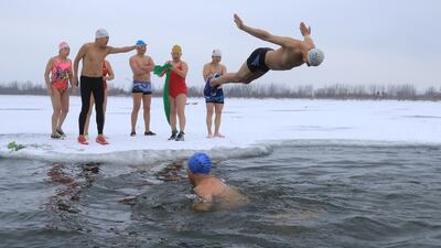 Winter swimmers enjoy the icy Songhua River in Harbin, Heilongjiang province, China. Reuters