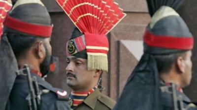 Pakistani Rangers and Indian Border Security Force personnel, center, take part in the daily flag lowering ceremony at the India-Pakistan joint border at Wagah. Indian security officials believe the ceasefire was successful primarily because of Mr Musharraf.