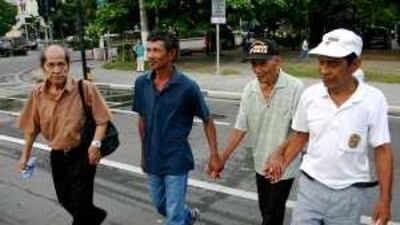 Left to right: Gagarin Rosete, an unidentified relative of Jose Gamozo, Gamozo and Dominador De La Cruz near the US Embassy in Manila.
