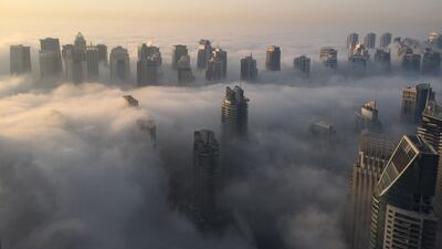 Dense fog across the UAE on Monday morning reduced visibility on the roads to less than 100 metres in some parts and prompted warnings from forecasters and police. Rene Slama / AFP