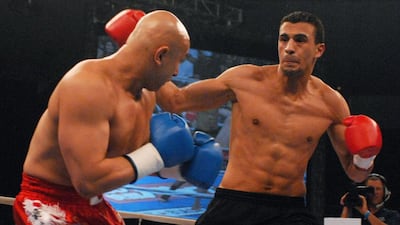 Badr Hari of Morrocco, right, is proud to fight as a Muslim in a Muslim country for the first time. Ronen Zilberman / AP Photo