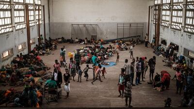 People shelter in the Samora M Machel secondary school in Beira, Mozambique, following the devastation caused by Cyclone Idai. AFP
