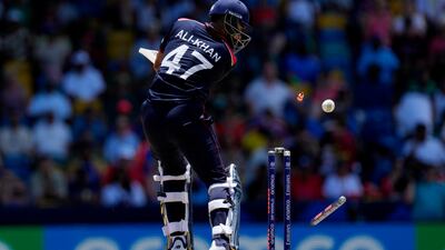 United States batter Ali Khan is bowled out by England's Chris Jordan for a duck.