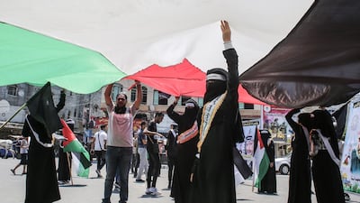 Palestinians rally against Israel's West Bank annexation plans, in Rafah in the southern Gaza Strip on June 29, 2020. / AFP / SAID KHATIB