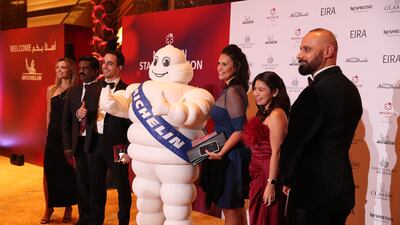 Guests with Bibendum, aka the Michelin Man, the group’s mascot.