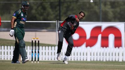 Mohammed Shahzad, right, of the UAE, shown here bowling against Pakistan at ICC academy in Dubai Sports City in Dubai, had his bowling action cleared by the International Cricket Council (ICC) on Monday. Pawan Singh / The National
