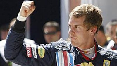 Red Bull driver Sebastian Vettel celebrates after qualifying in pole position for the Turkish Grand Prix at Istanbul's Otodrom.