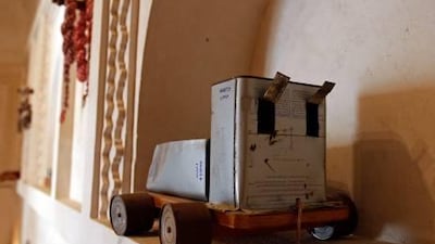 Lea'bat Ma'wa'ter, or cars game, was played by building toy cars from empty oil cans and using smaller tins for wheels.