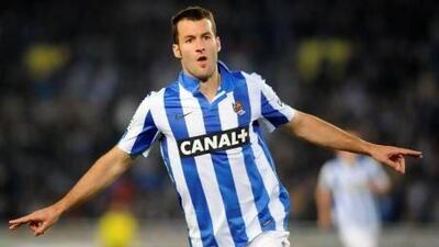 Real Sociedad's forward Imanol Agirretxe celebrates after scoring on their way to defeating Valencia, which appeared to lock up fourth place in the Primera Liga for La Real.