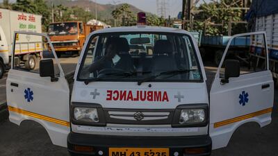 An ambulance driver waits to refill oxygen tanks in Navi Mumbai on April 22, 2021 as India reported a record one-day jump in Covid-19 cases with more than 300,000 new infections. Bloomberg