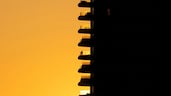 A person on a balcony of a building during sunset in Nicosia, Cyprus. Reuters