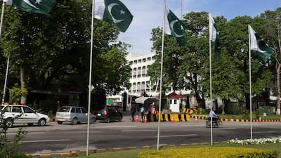 Pakistani security officials stand guard at a checkpoint as security has been intensified ahead of the visit of US and Iranian delegations in Islamabad, Pakistan. EPA