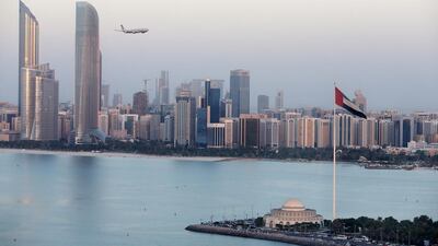 Etihad Airway's Airbus A340-500 cruises at a low altitude of no more than 600 feet over the Abu Dhabi corniche to mark the airline's 10-year anniversary. Pawan Singh / The National