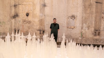 Elias Nafaa with his installation Handle with Care, which examines the nature of violence and how conflict is documented. Photo: Hugo Delgado