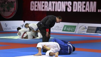 A referee keeps a close eye on the match during day two of the Abu Dhabi Kids World Championship on Saturday, April 16, 2016, at the IPIC Arena at Zayed Sports City in Abu Dhabi. Delores Johnson / The National