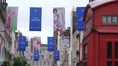 Flags designed by British fashion illustrator Anjelica Roselyn on display across South Molton Street in Mayfair to celebrate the jubilee. PA