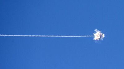 A picture taken from the southern Israeli border with the Gaza Strip shows the trail of a missile launched by Israel’s Iron Dome defence system, designed to intercept and destroy incoming short-range rockets and artillery shells, as it intercepts and destroys a rocket launched from Gaza into Israel. Jack Guez / AFP