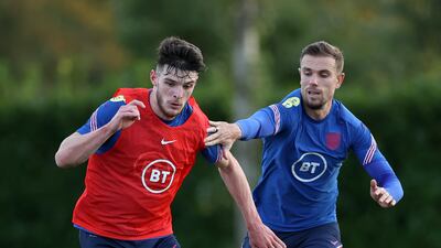 Declan Rice battles for possession with Jordan Henderson during a training session at Tottenham Hotspur Training Centre.