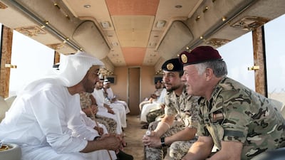 Sheikh Mohamed bin Zayed, Crown Prince of Abu Dhabi and Deputy Supreme Commander of the UAE Armed Forces (L), King Abdullah II, King of Jordan (R) and Hussein bin Abdullah, Crown Prince of Jordan (2nd R), inspect military exercise sites during the UAE and Jordan joint military drill at Al Hamra Camp.