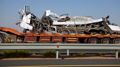 The remnants of the bus being hauled from the scene of a tragic traffic accident on Monday early evening, Feb. 4, 2013. Silvia Razgova / The National