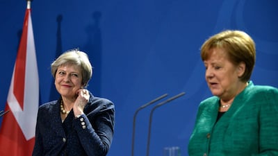 epa06533415 German Chancellor Angela Merkel (R) and British Prime Minister Theresa May (L) address the media during a joint press conference after their meeting at the Chancellery in Berlin, Germany, 16 February 2018. At a joint meeting they discussed about European issues including the euro-exit of Britain and international issues. EPA/MARKUS HEINE