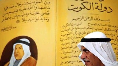 The opposition MP Ahmad Al Saadun at a meeting with Kuwaiti youth in Kuwait City last weekend. In the background is Kuwait's constitution and a portrait of late emir Sheikh Abdullah Al Salem Al Sabah.